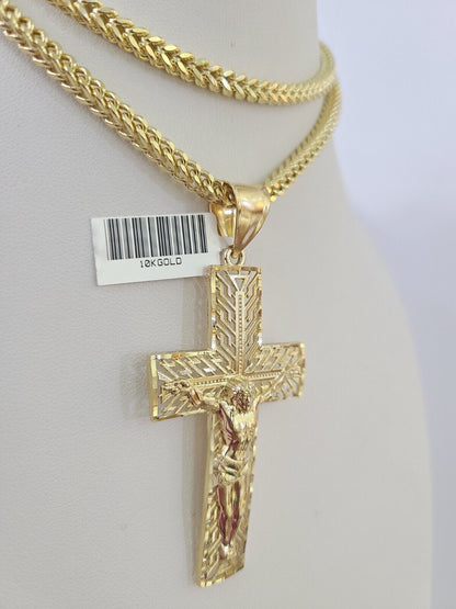 Close-up detailed view of 10K yellow gold Jesus crucifix pendant charm