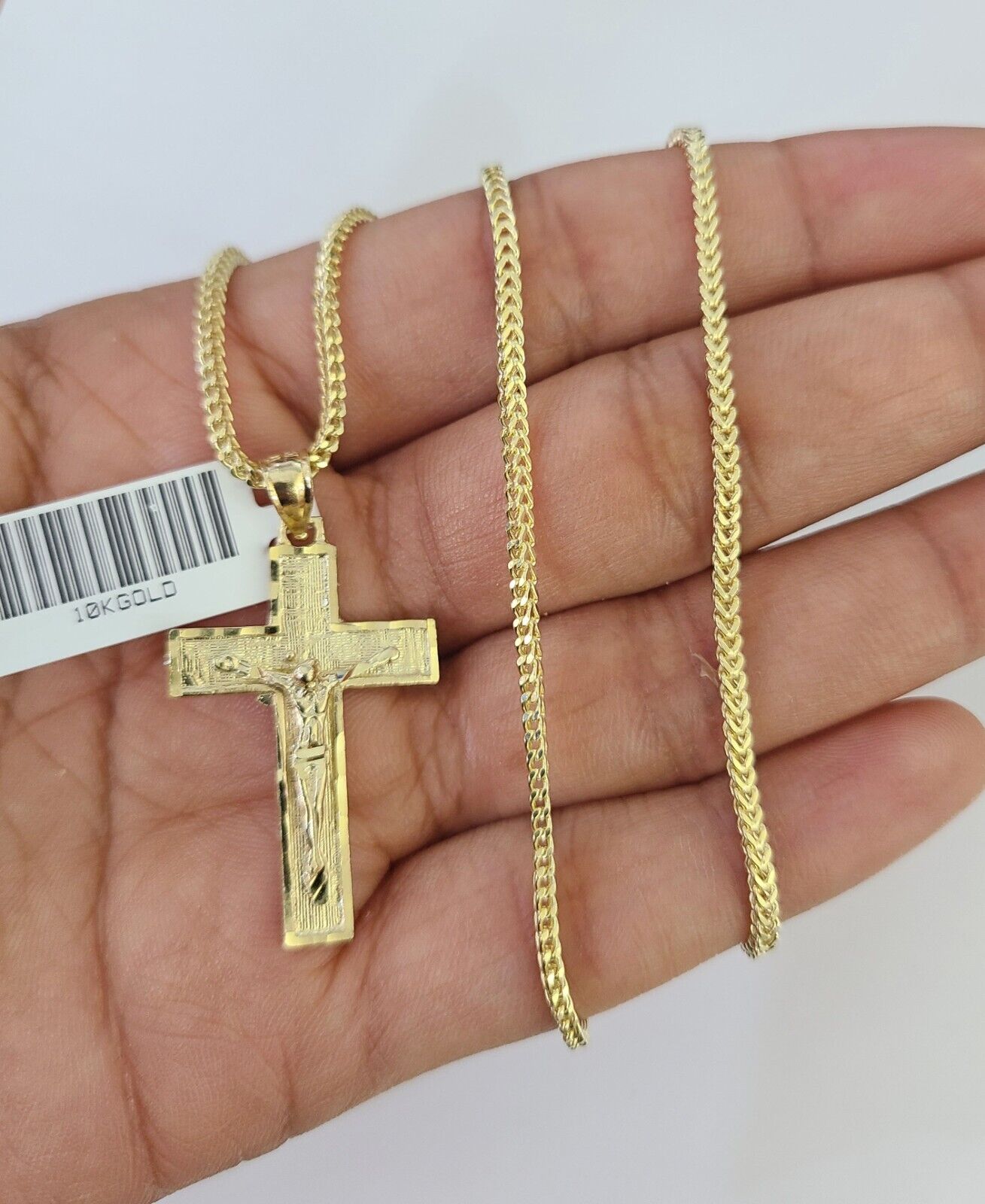 Front view of Jesus cross pendant necklace in 10K gold with Franco chain