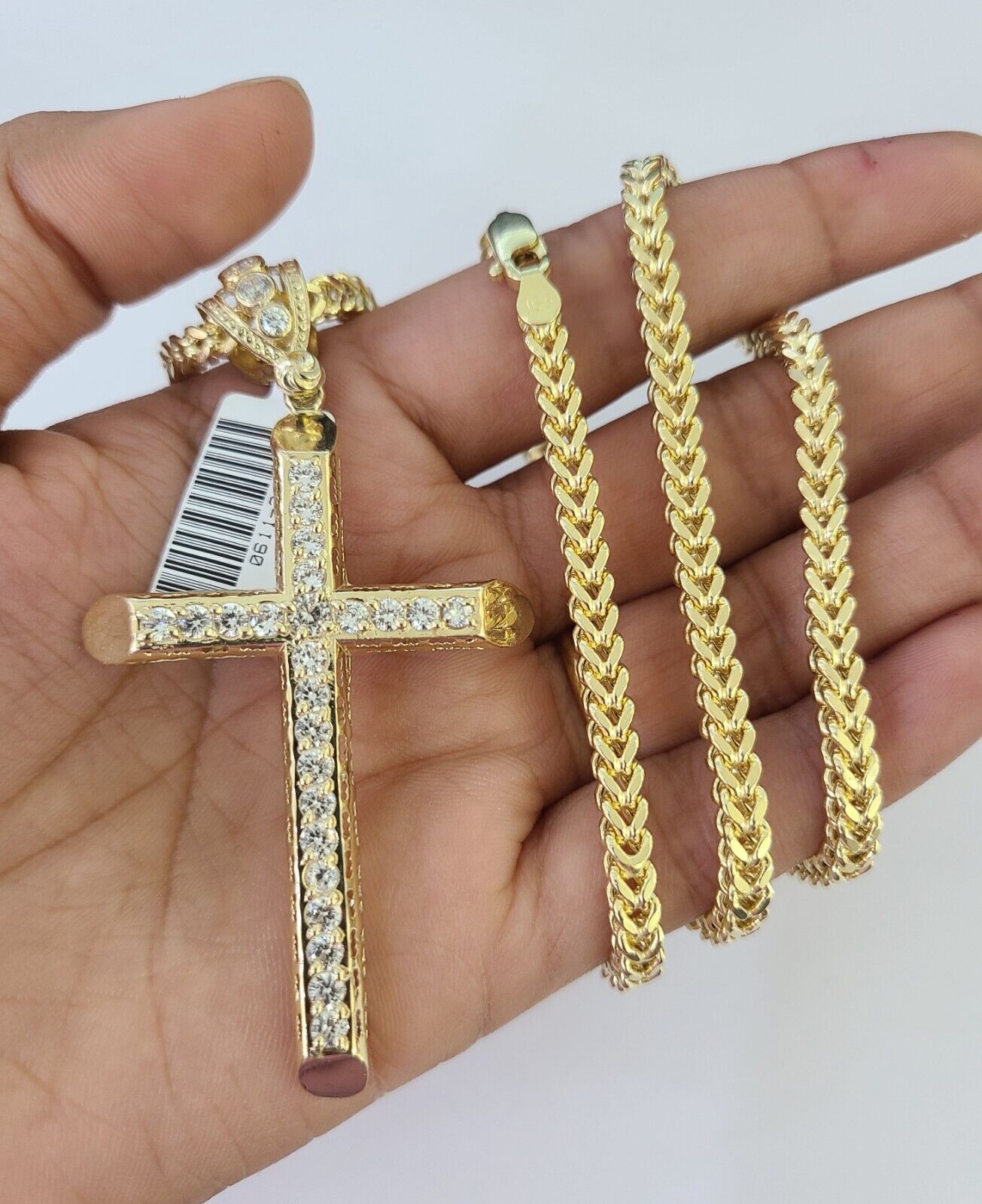 Detailed macro shot of 10K yellow gold Franco chain links