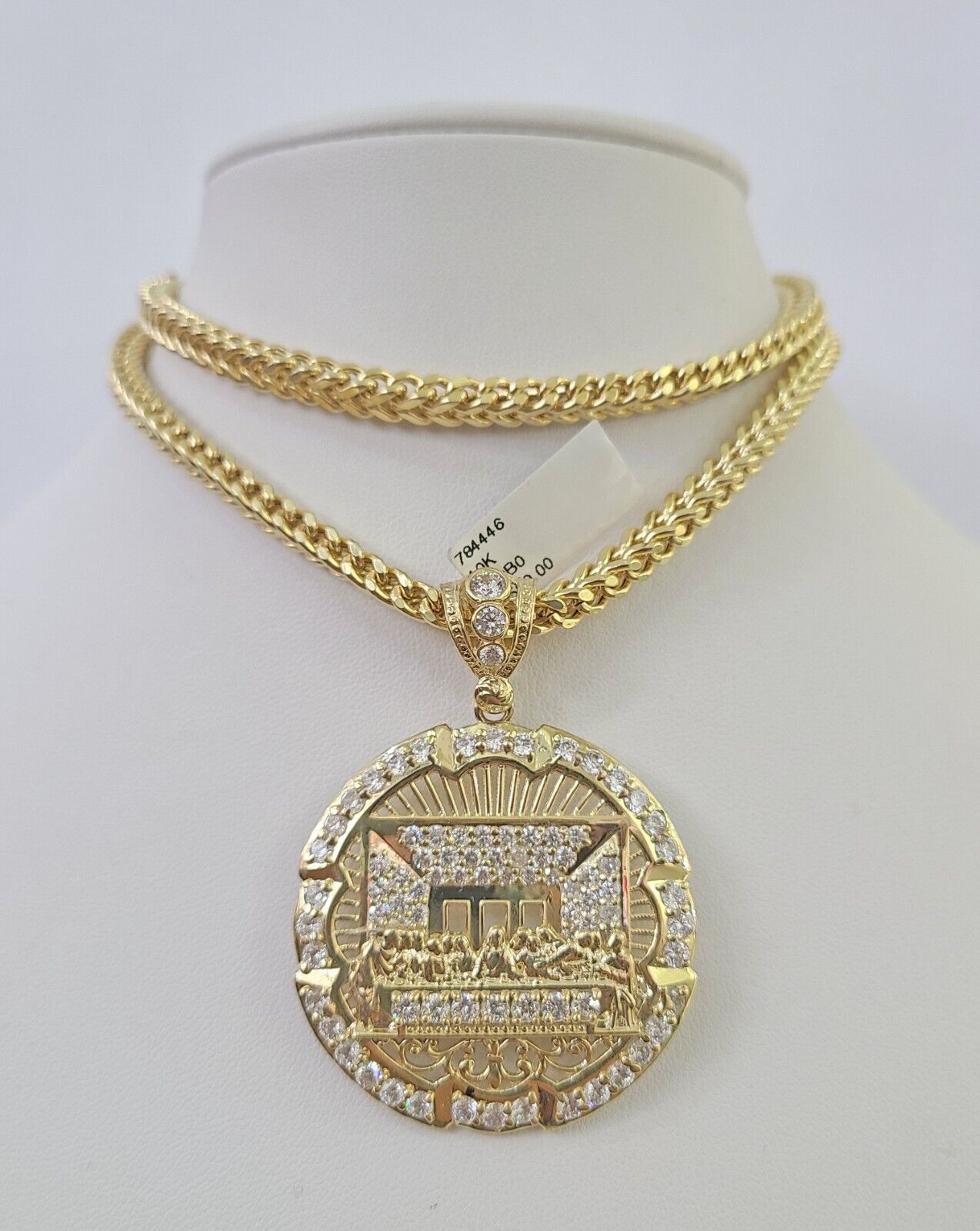 Full display of 10K yellow gold Franco chain with Last Supper pendant