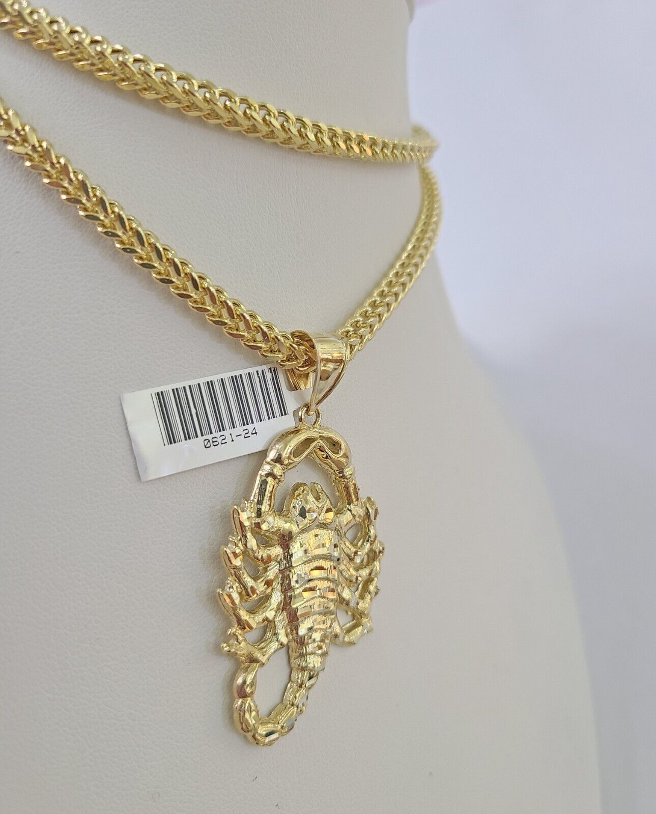Detailed macro shot of 10K yellow gold Franco chain links