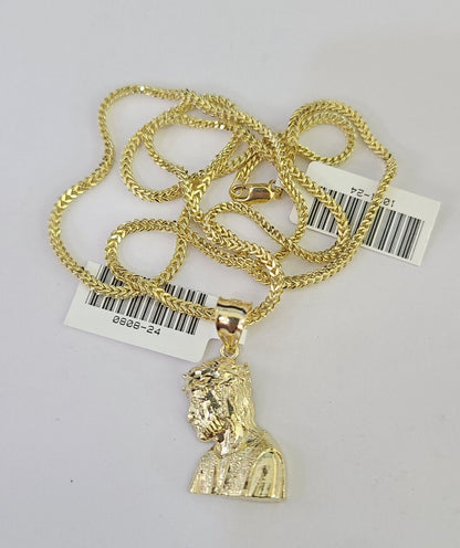 Close-up detailed view of 10K yellow gold Jesus head pendant charm