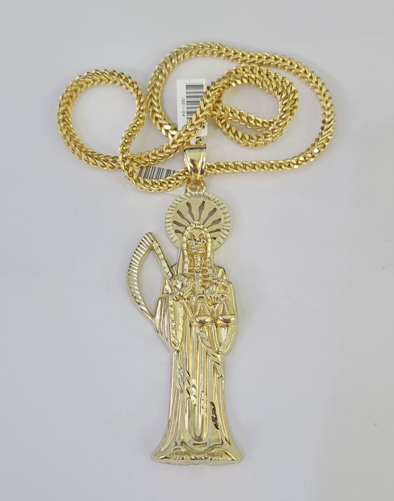 Close-up detailed view of 10K yellow gold Saint Reaper pendant charm