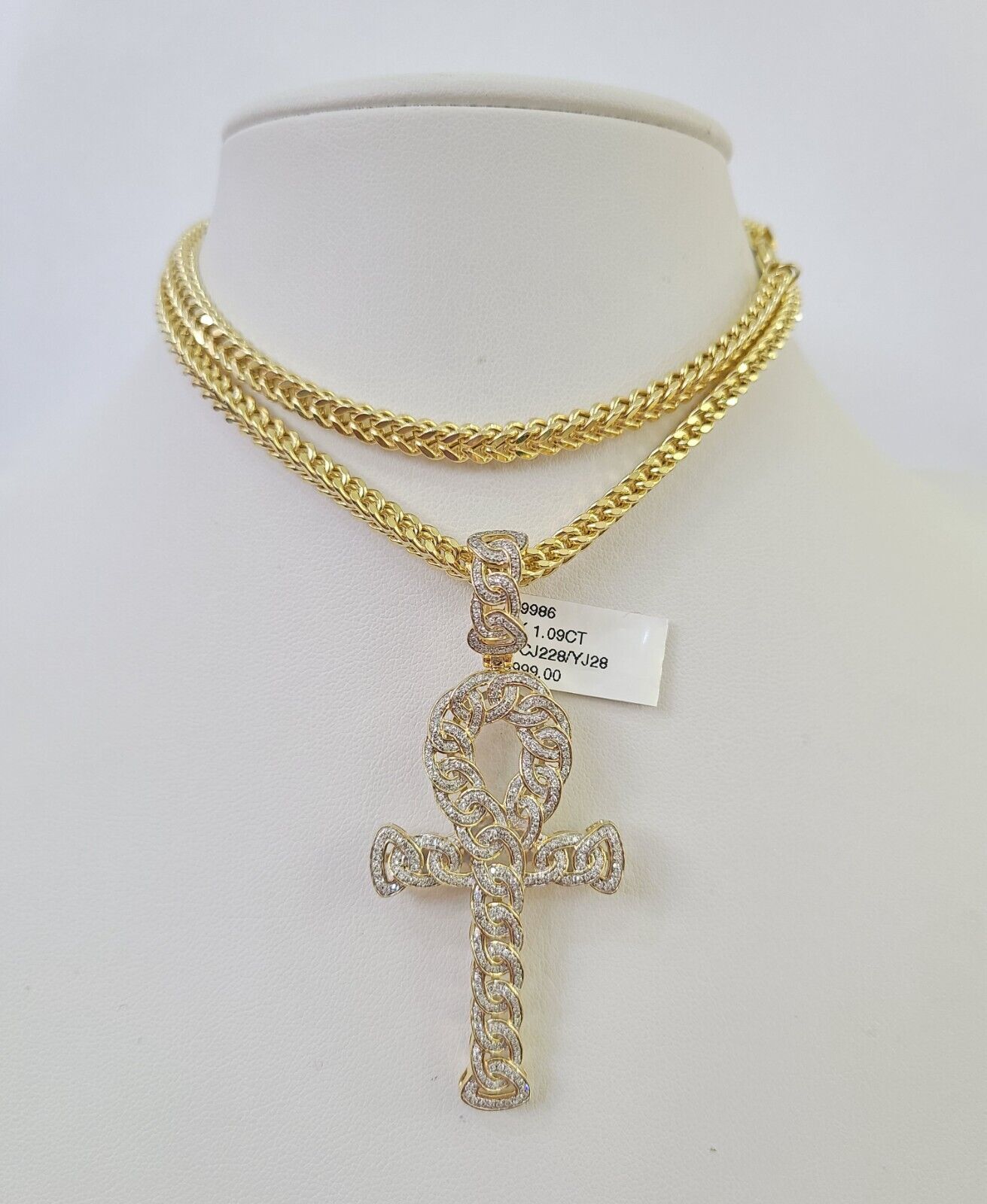 Front view of diamond-studded Jesus cross pendant necklace in 10K gold