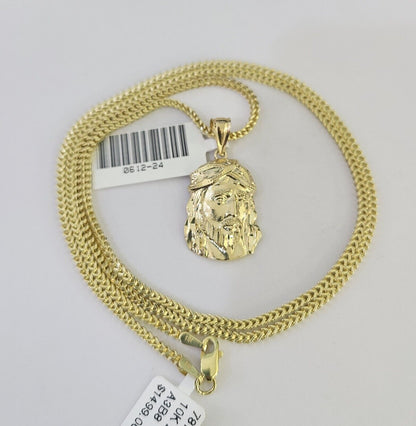 Lifestyle or alternate angle view of 10K gold Jesus head necklace by Reva Jeweler