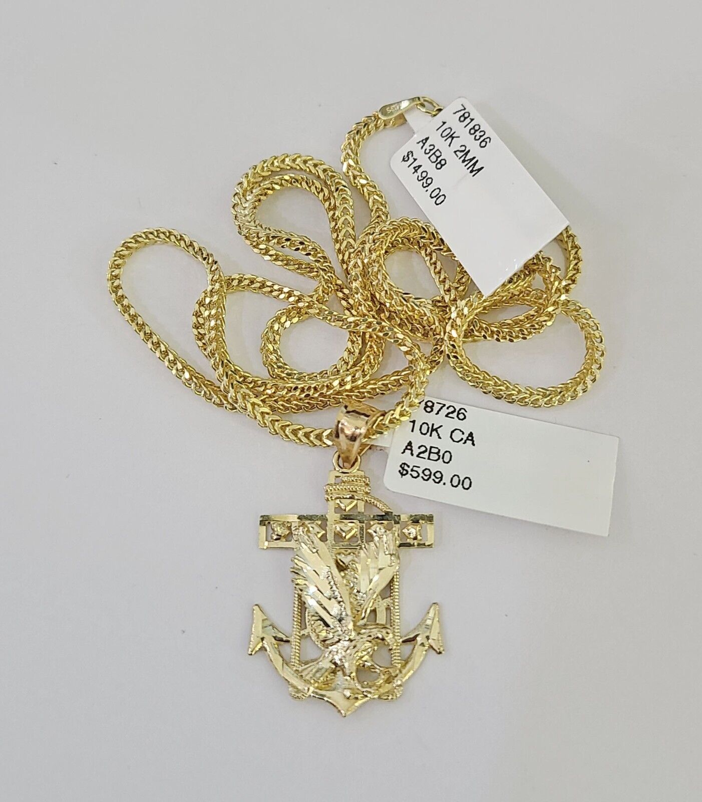 Polished 10K gold eagle anchor pendant necklace with chain links