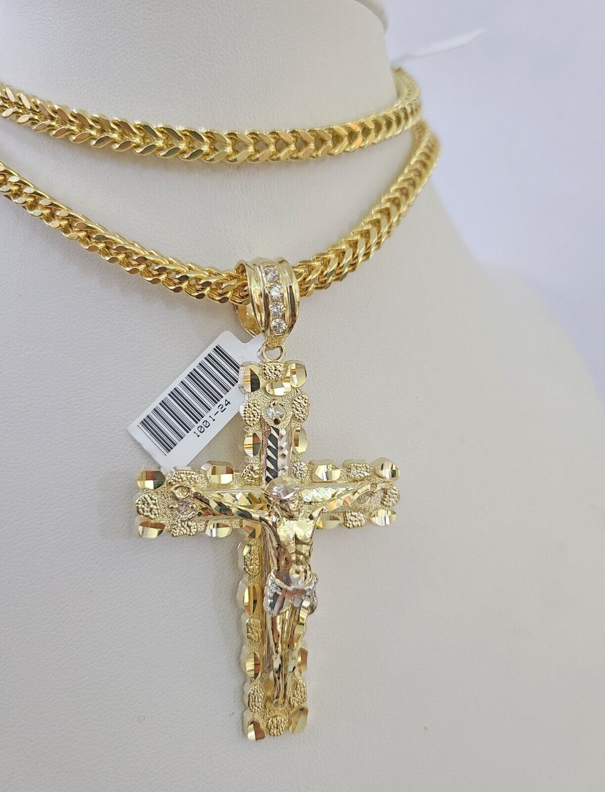 Full display of 10K yellow gold Franco chain with Jesus cross pendant