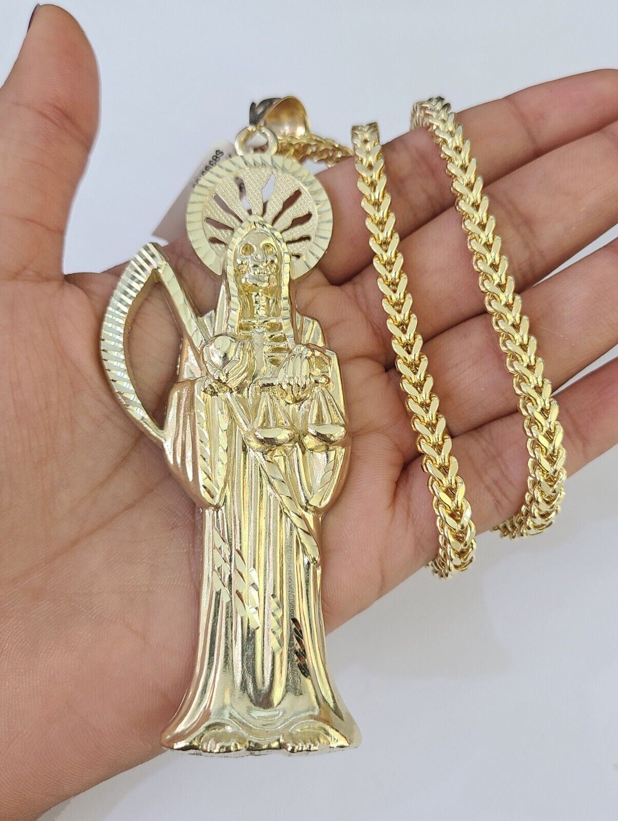 Detailed macro shot of 10K yellow gold Franco chain links