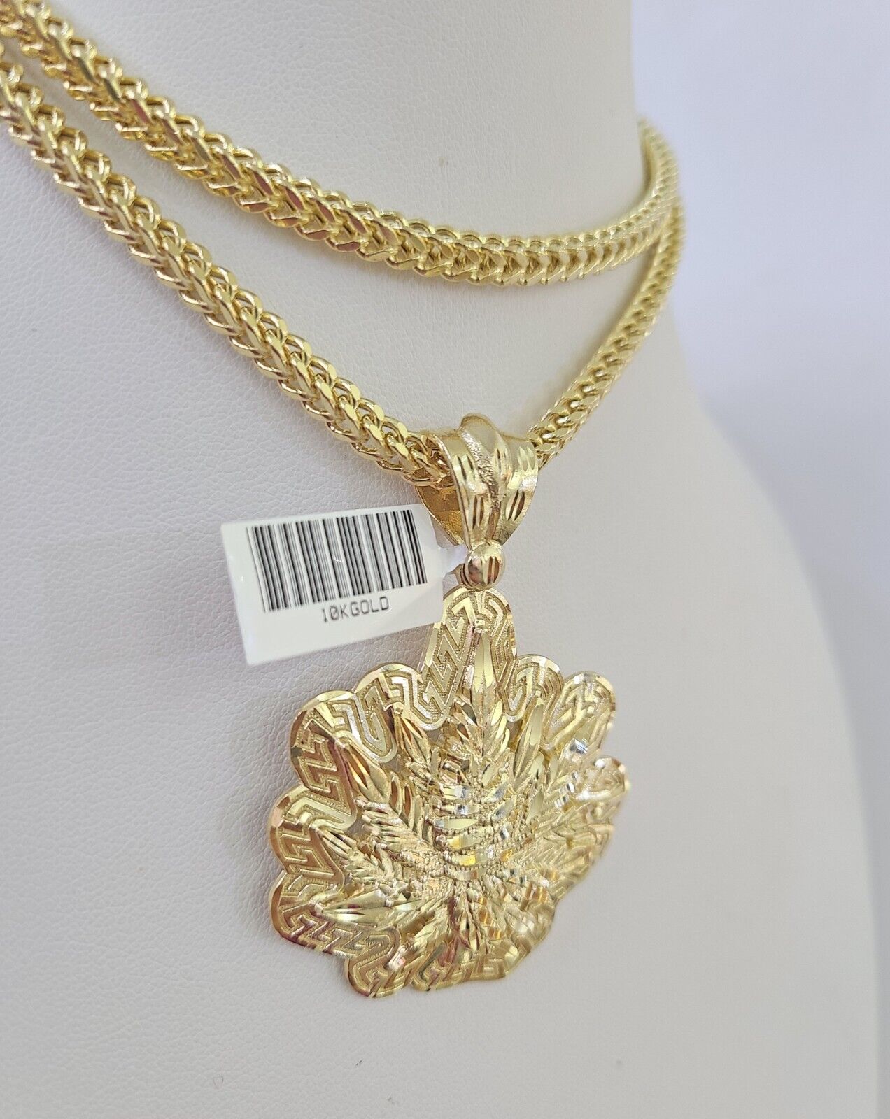 Full display of 10K yellow gold Franco chain with weed leaf pendant