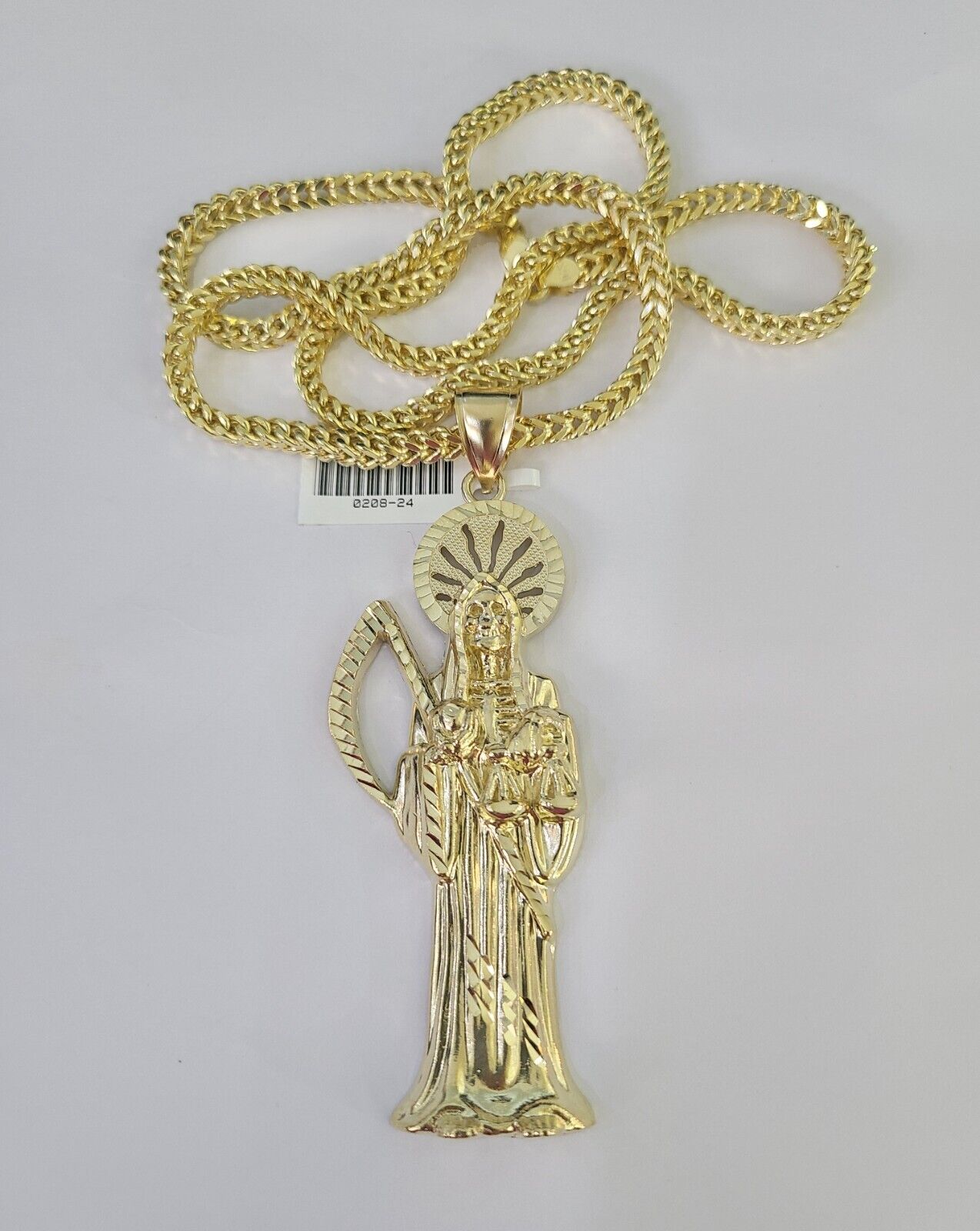 Detailed macro shot of 10K yellow gold Franco chain links