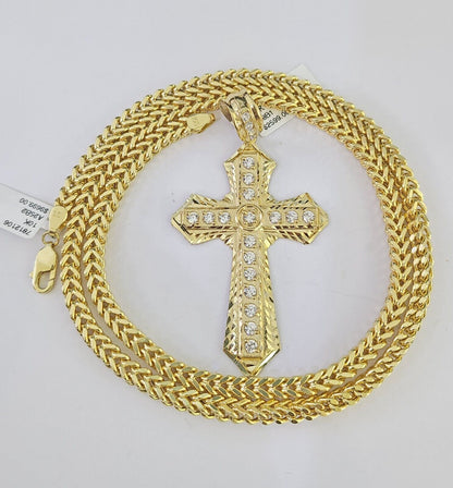 Close-up of 10K yellow gold Jesus cross pendant on Franco chain necklace