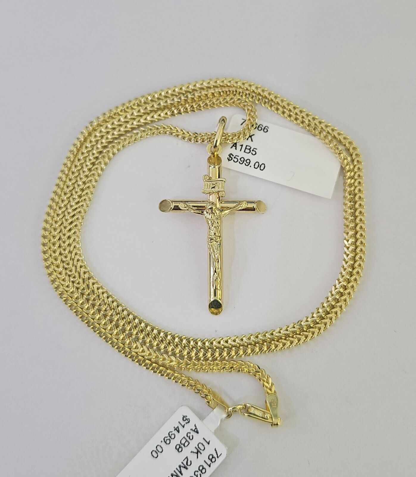 Front view of INRI Jesus cross pendant necklace in 10K gold with Franco chain