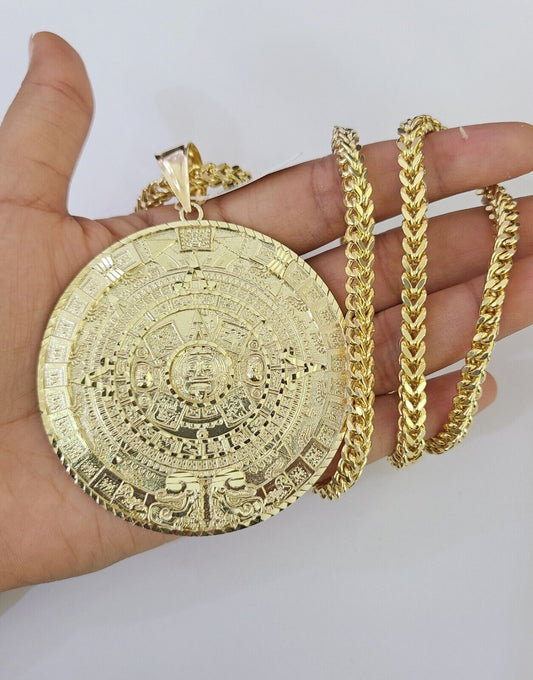 Full display of 10K gold Franco chain with Mayan calendar pendant