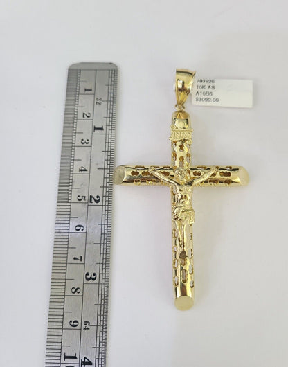Front view of INRI cross pendant necklace in 10K gold with Franco chain