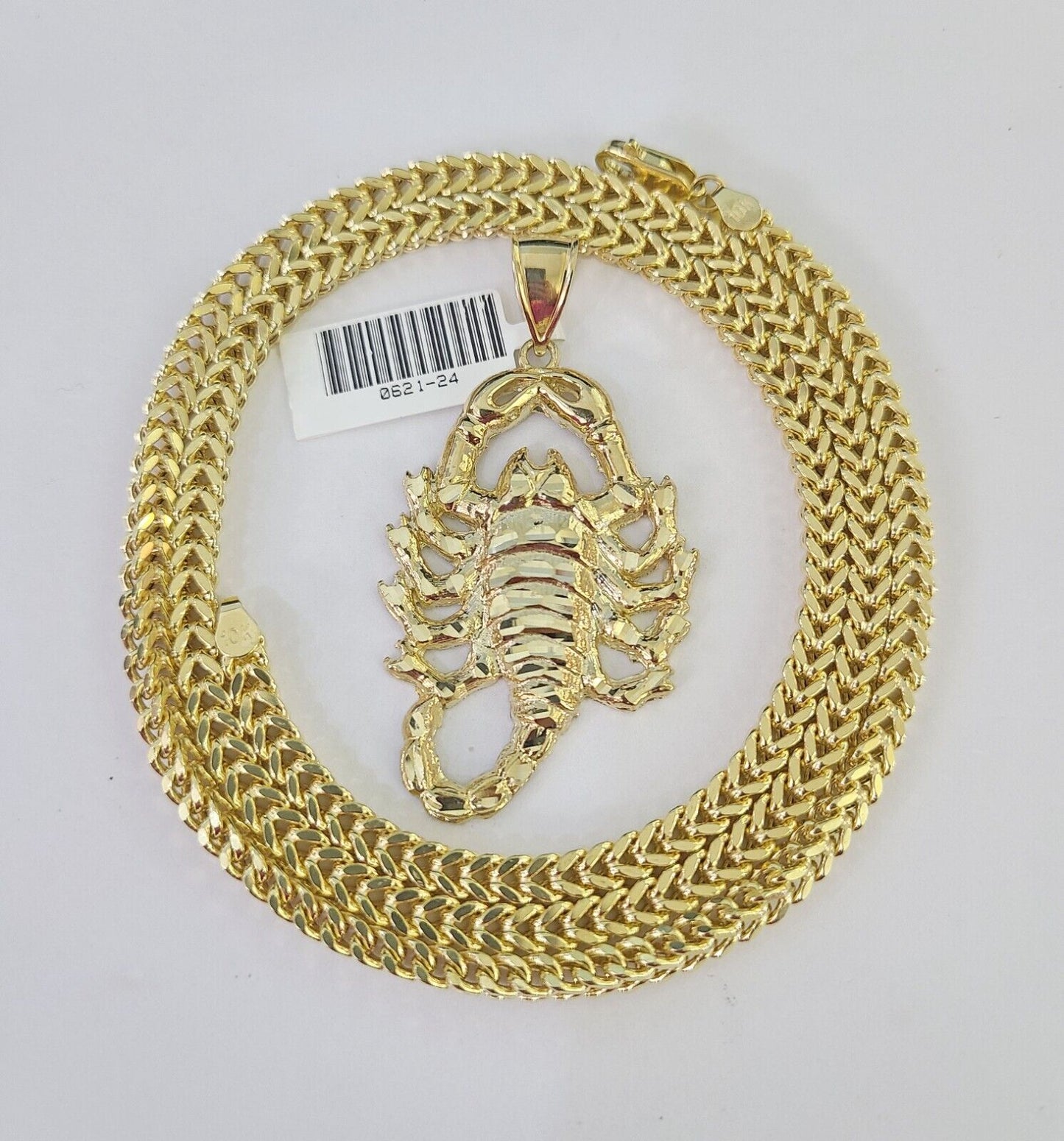 Close-up detailed view of 10K yellow gold Scorpio pendant charm