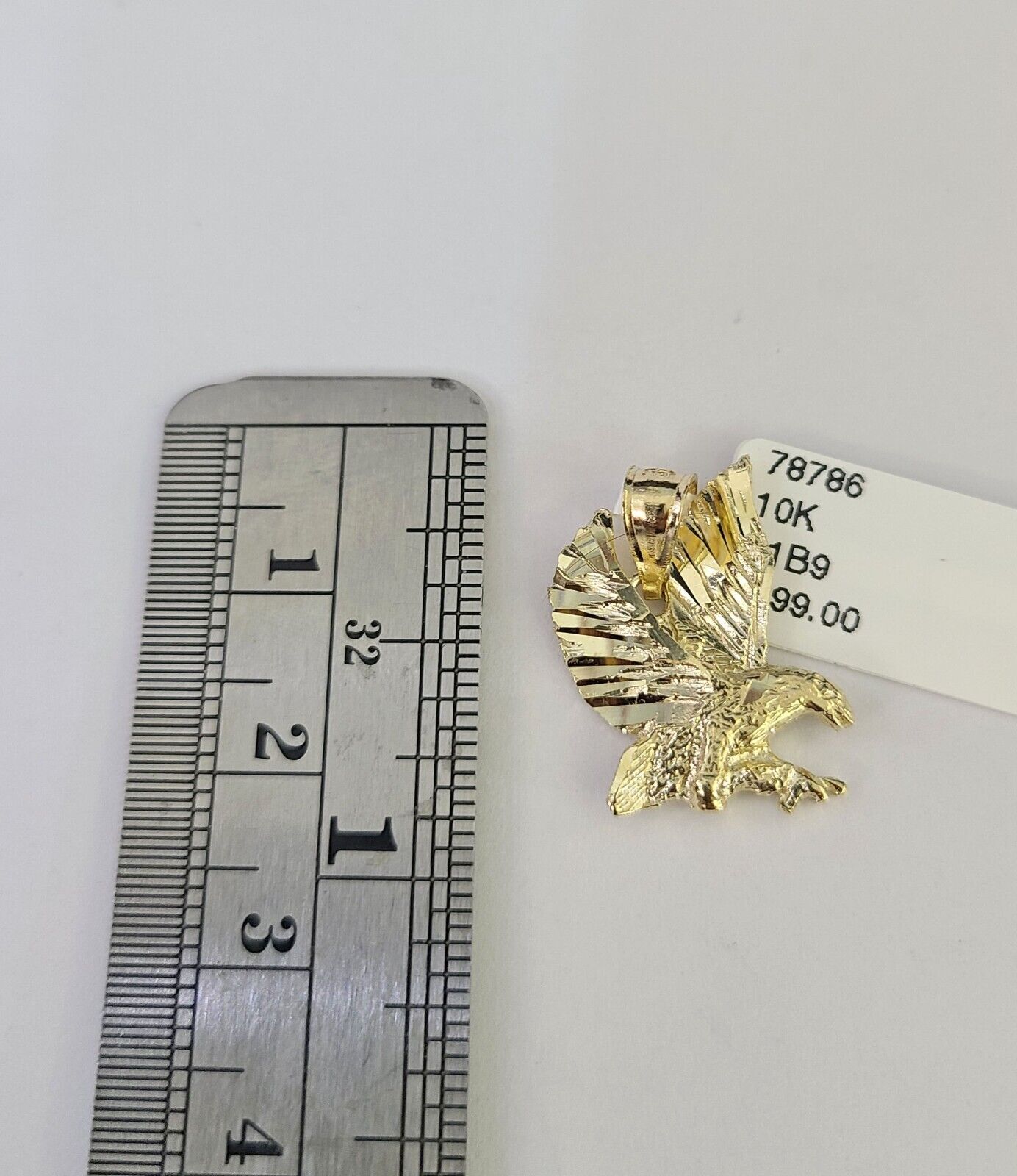 Polished 10K gold eagle pendant necklace with chain links