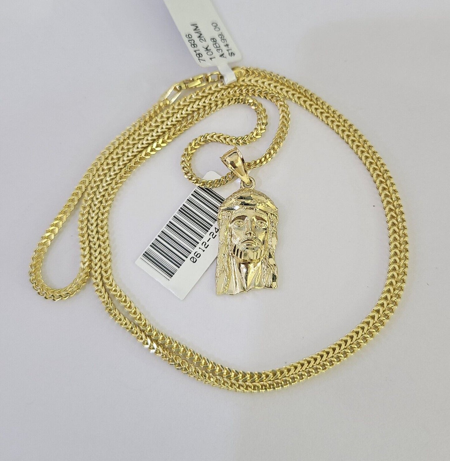 Close-up detailed view of 10K yellow gold Jesus head pendant charm