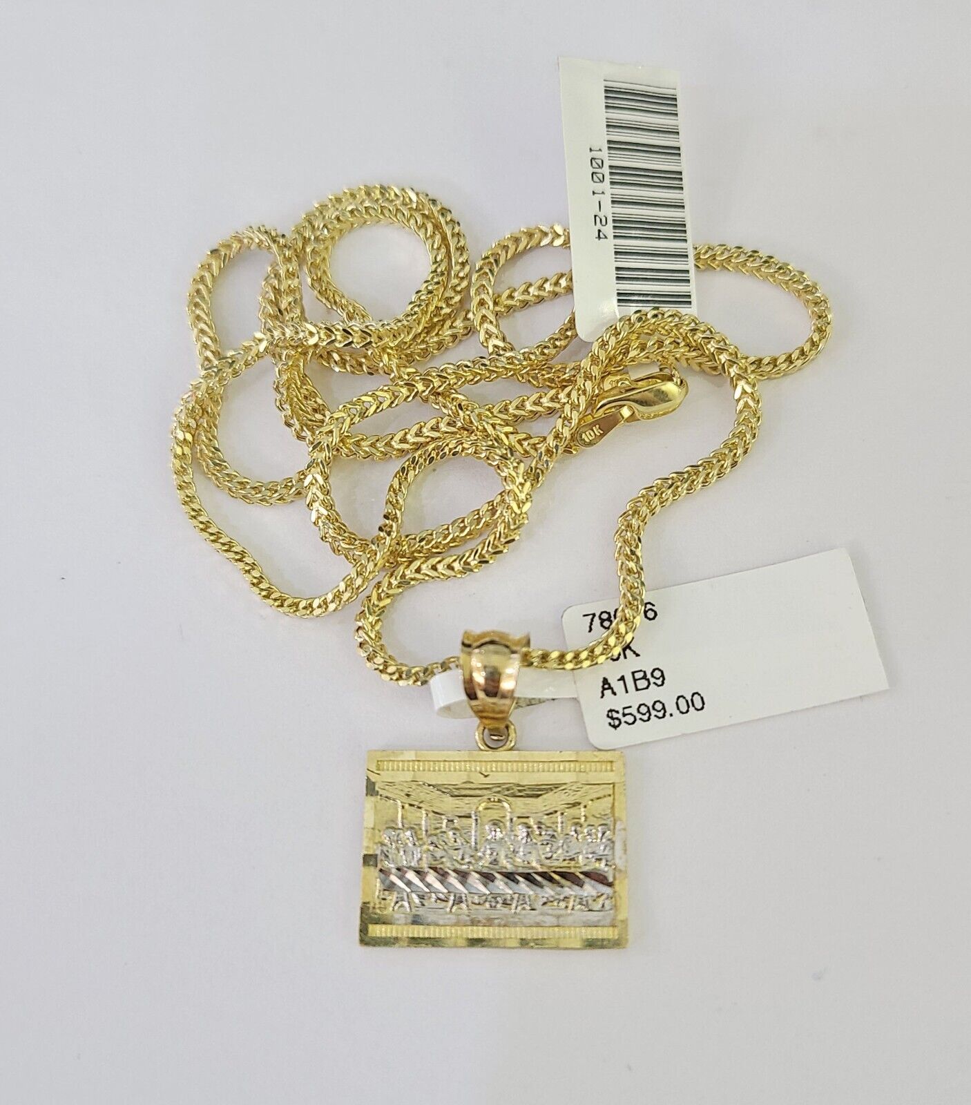 Full display of 10K gold Franco chain with Mayan calendar pendant