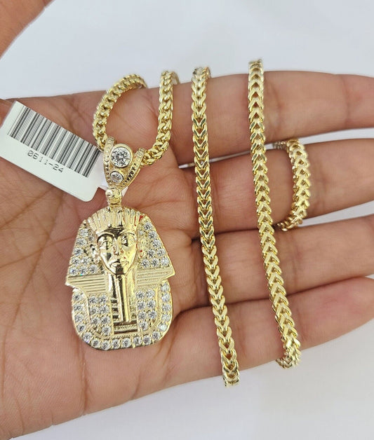 Side angle view of 10K yellow gold pharaoh pendant on Franco chain