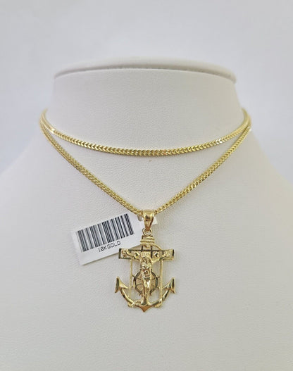 Close-up detail of Jesus anchor pendant in 10K gold jewelry design