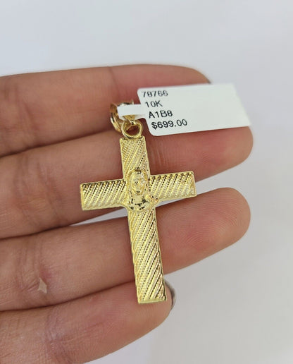 Close-up of 10K yellow gold Jesus cross pendant on Franco chain necklace