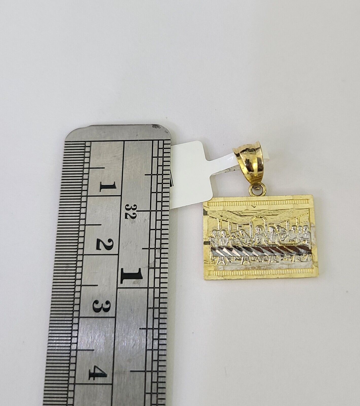 Close-up detailed view of 10K gold Mayan calendar pendant charm