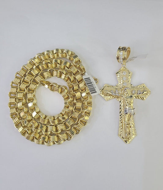Full display of 10K gold 9mm Byzantine chain with Jesus cross pendant