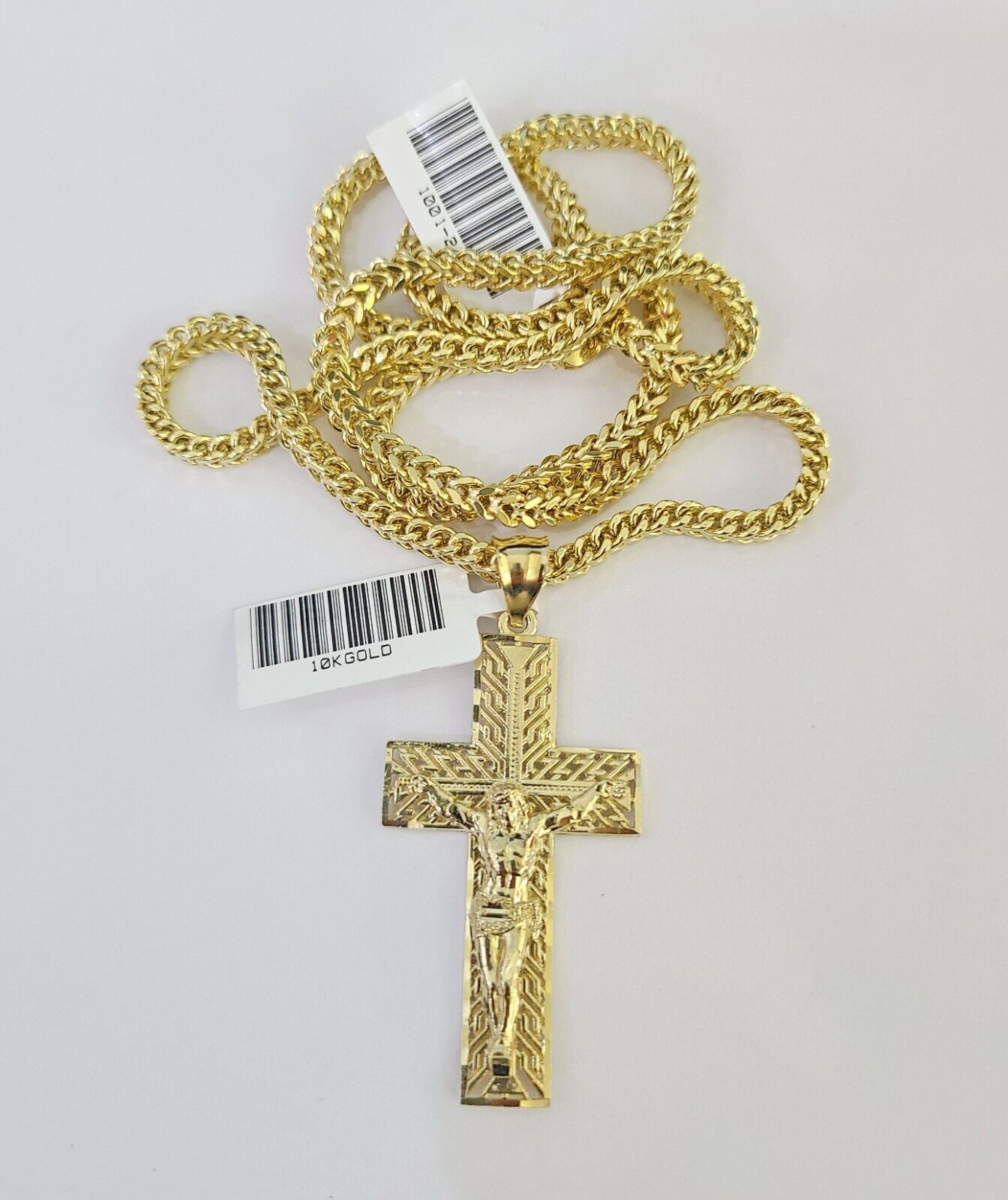 Side angle view of Franco chain necklace featuring Jesus cross pendant charm