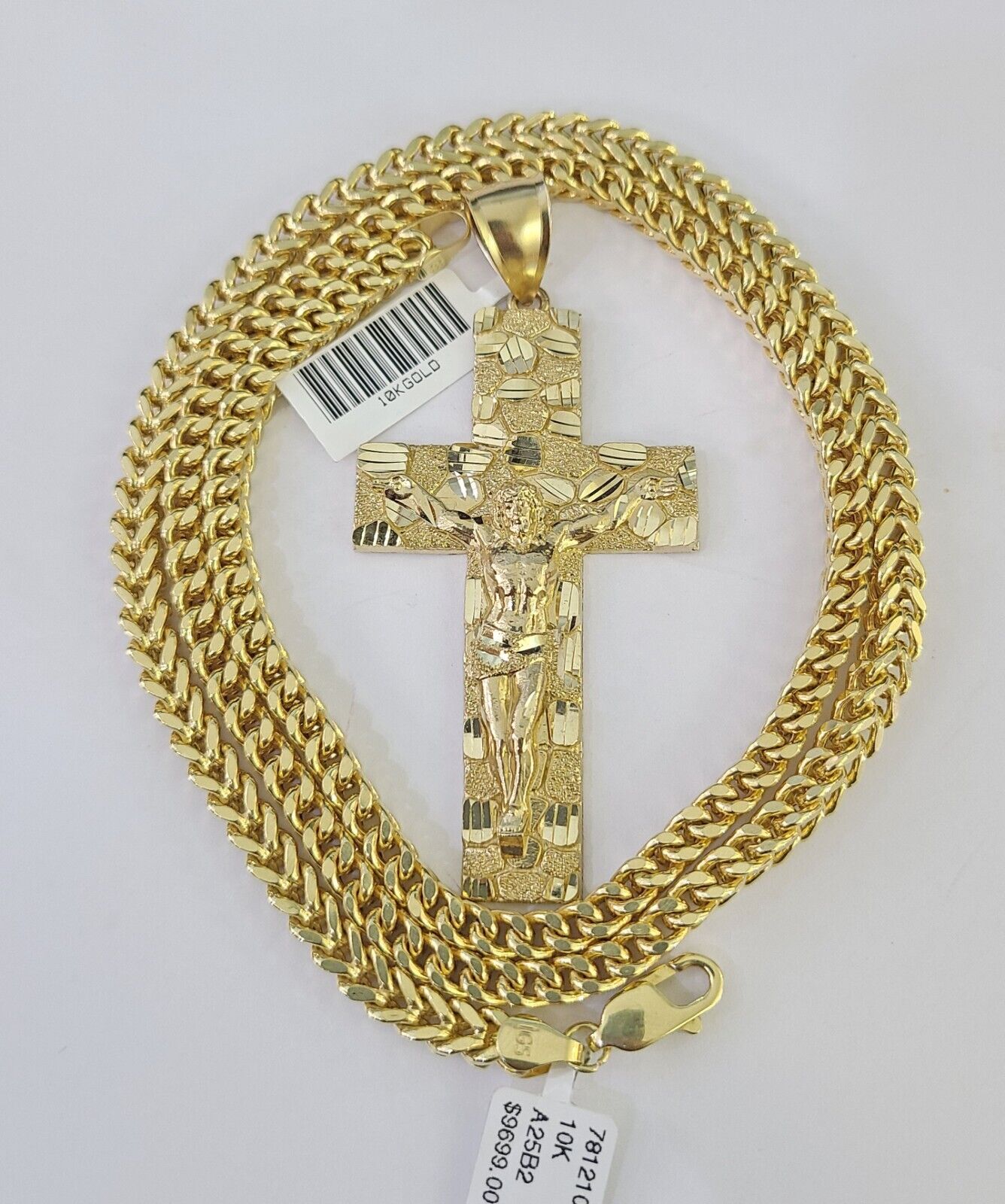 Close-up of 10K yellow gold Jesus cross pendant on Franco chain necklace