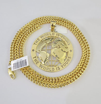 Flat lay display of Reva Jeweler 10K gold "The World Is Yours" necklace set