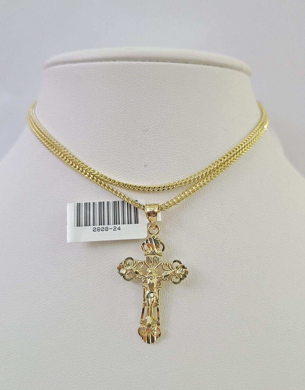 Side angle view of Franco chain necklace featuring Jesus cross pendant charm