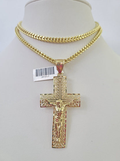 Flat lay display of Reva Jeweler 10K yellow gold crucifix necklace set