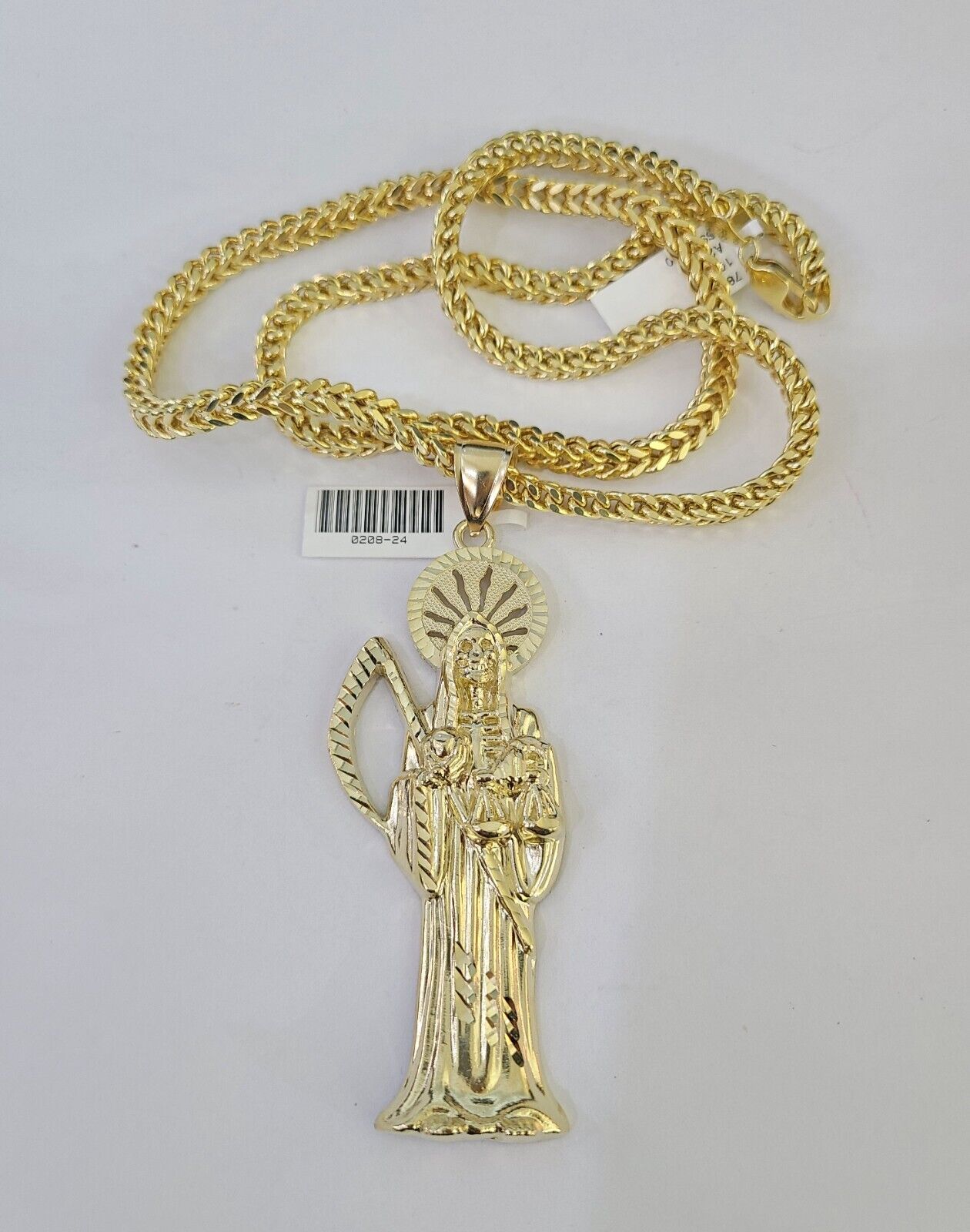 10K yellow gold Saint Reaper pendant and Franco chain necklace set by Reva Jeweler