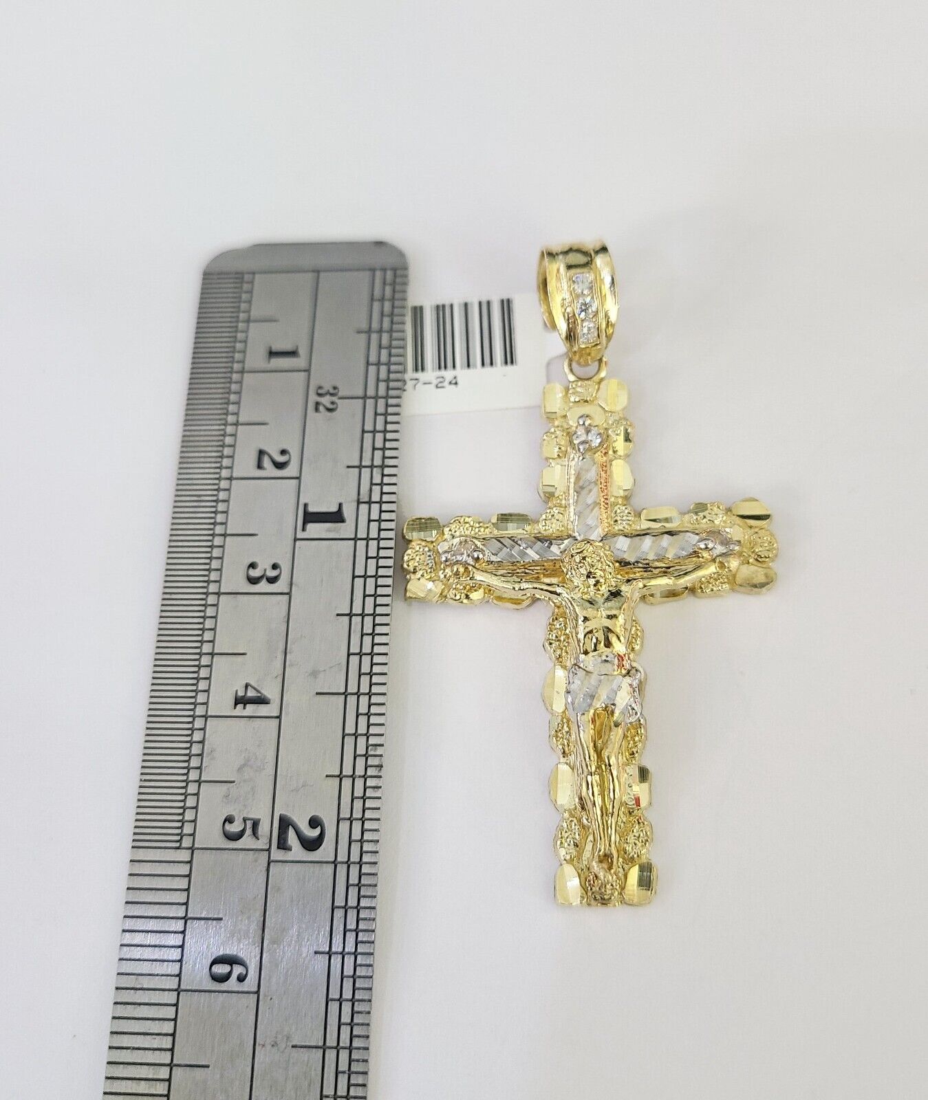 Side angle view of Franco chain necklace featuring Jesus cross pendant charm