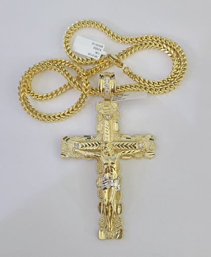 Front-facing view of Reva Jeweler 10K gold cross pendant and chain