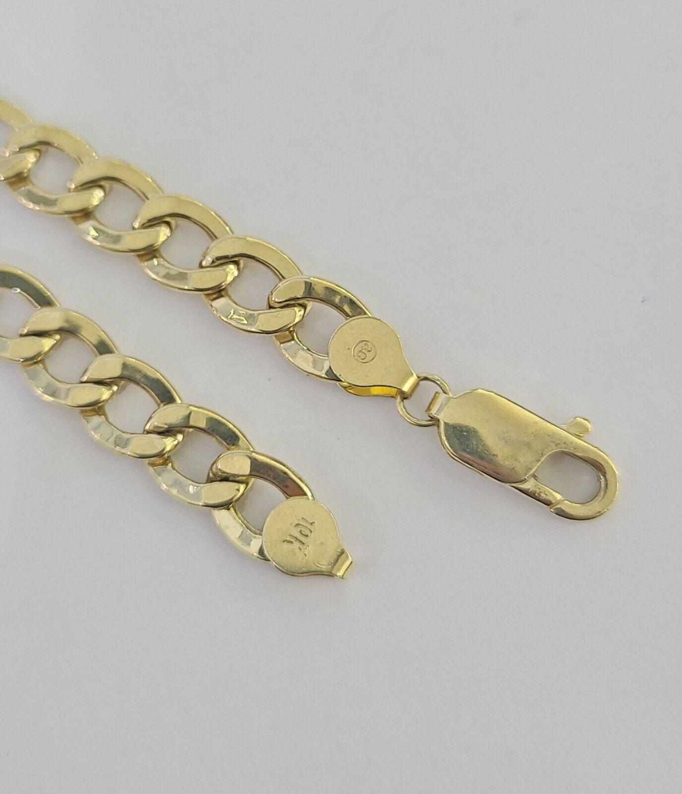 Detailed Cuban link chain design on 10K Yellow Gold ID Bracelet