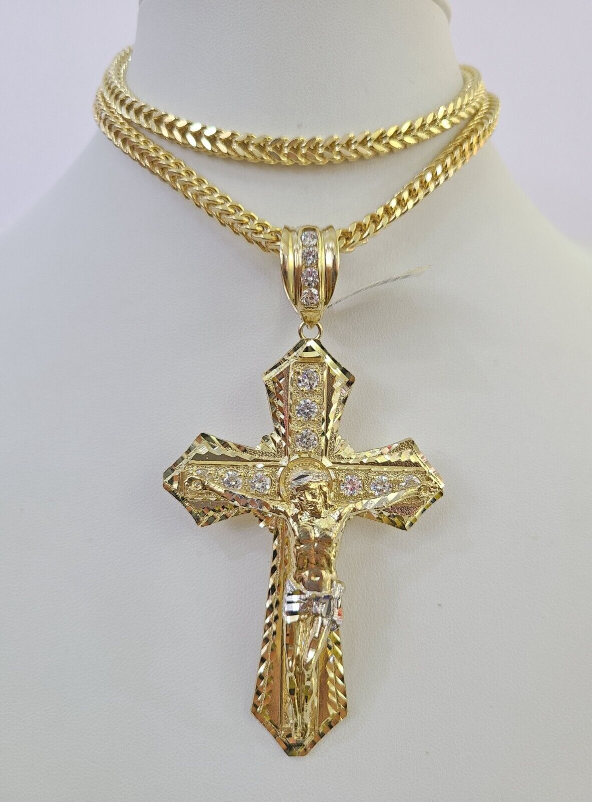 Close-up detailed view of the 10K yellow gold Jesus cross charm