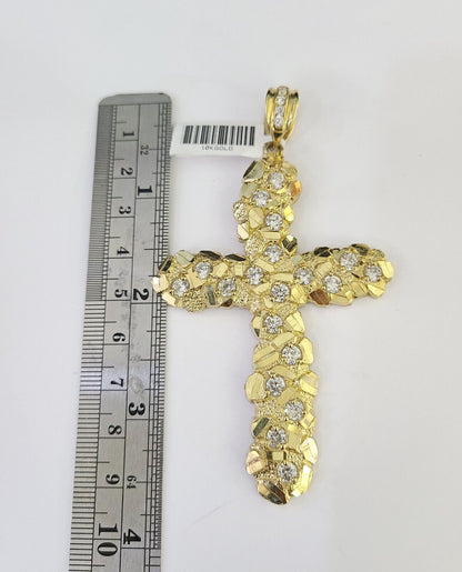 Close-up detailed view of 10K yellow gold Jesus cross pendant charm