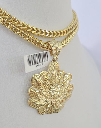 Close-up detailed view of 10K yellow gold tree leaf pendant charm