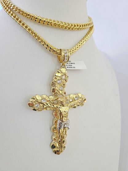 10K yellow gold Jesus cross pendant on a Franco chain necklace by Reva Jeweler