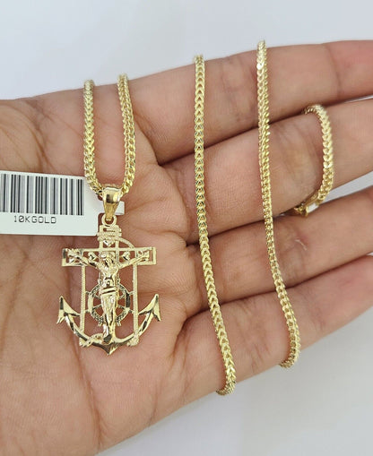 Close-up of 10K yellow gold Jesus anchor pendant on Franco chain necklace