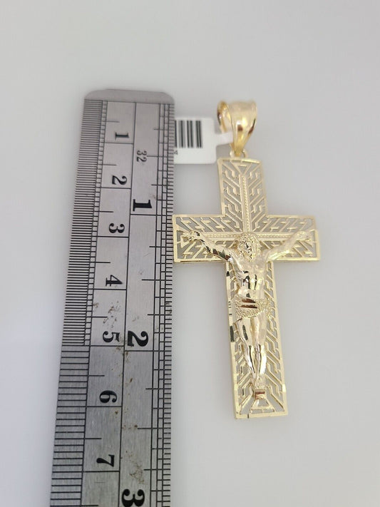 Close-up detailed view of 10K gold Jesus cross pendant charm