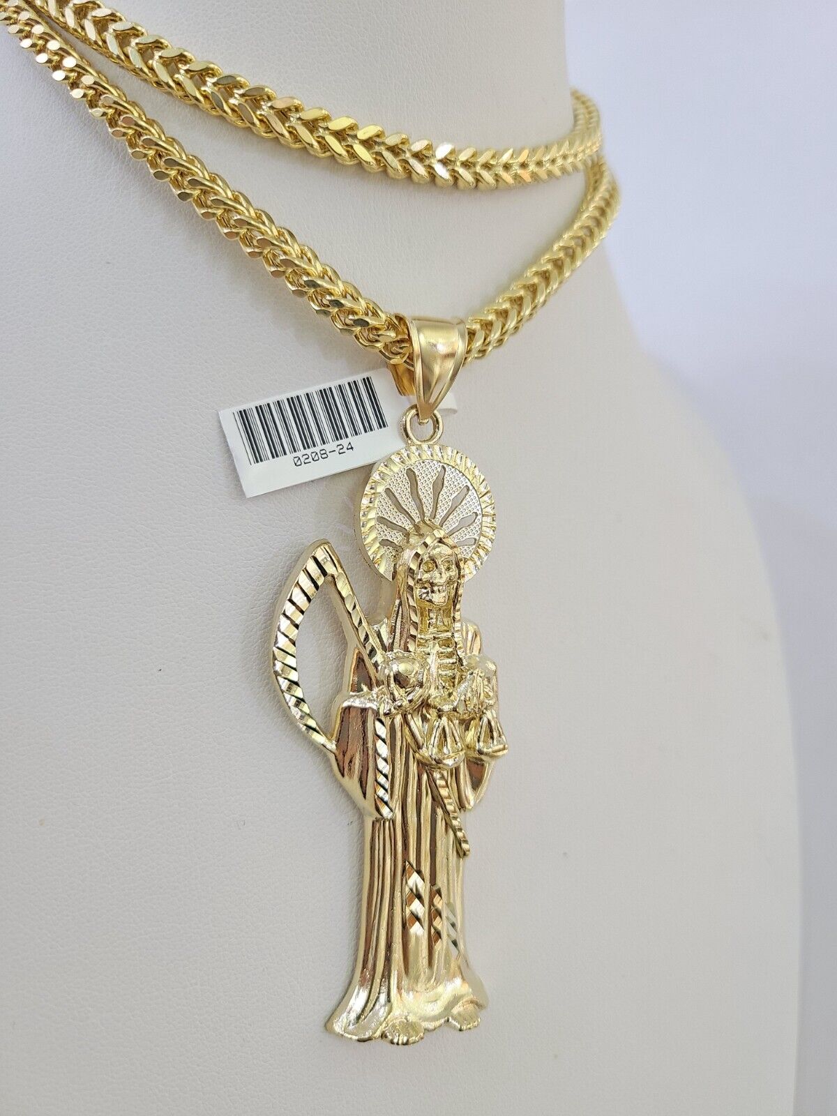 Front-facing view of Reva Jeweler 10K gold Saint Reaper pendant and chain
