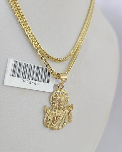 Front-facing view of Reva Jeweler 10K gold Jesus pendant and chain
