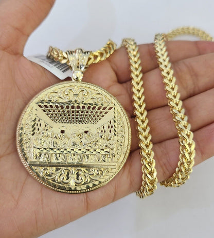 Side angle view of 10K yellow gold Last Supper pendant on Franco chain
