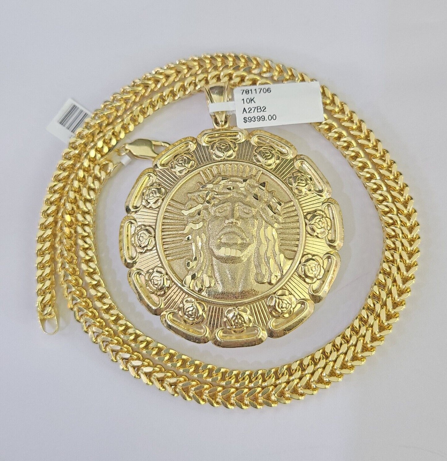 Full display of 10K yellow gold Franco chain with Jesus and Mary pendant