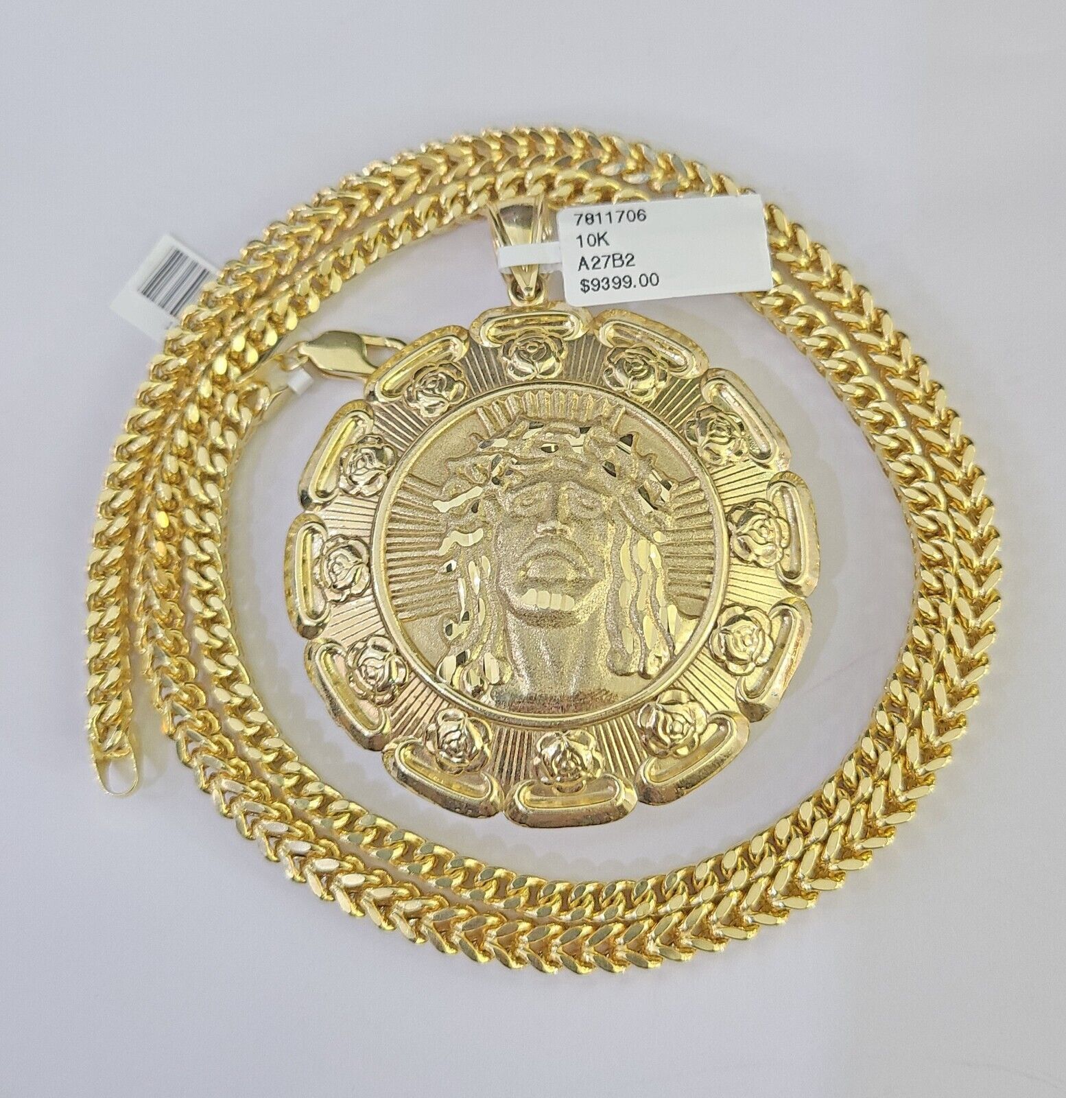 Full display of 10K yellow gold Franco chain with Jesus and Mary pendant