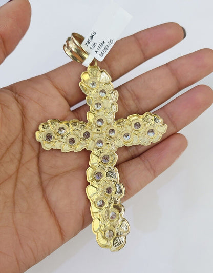 Front-facing view of Reva Jeweler 10K gold cross pendant and chain