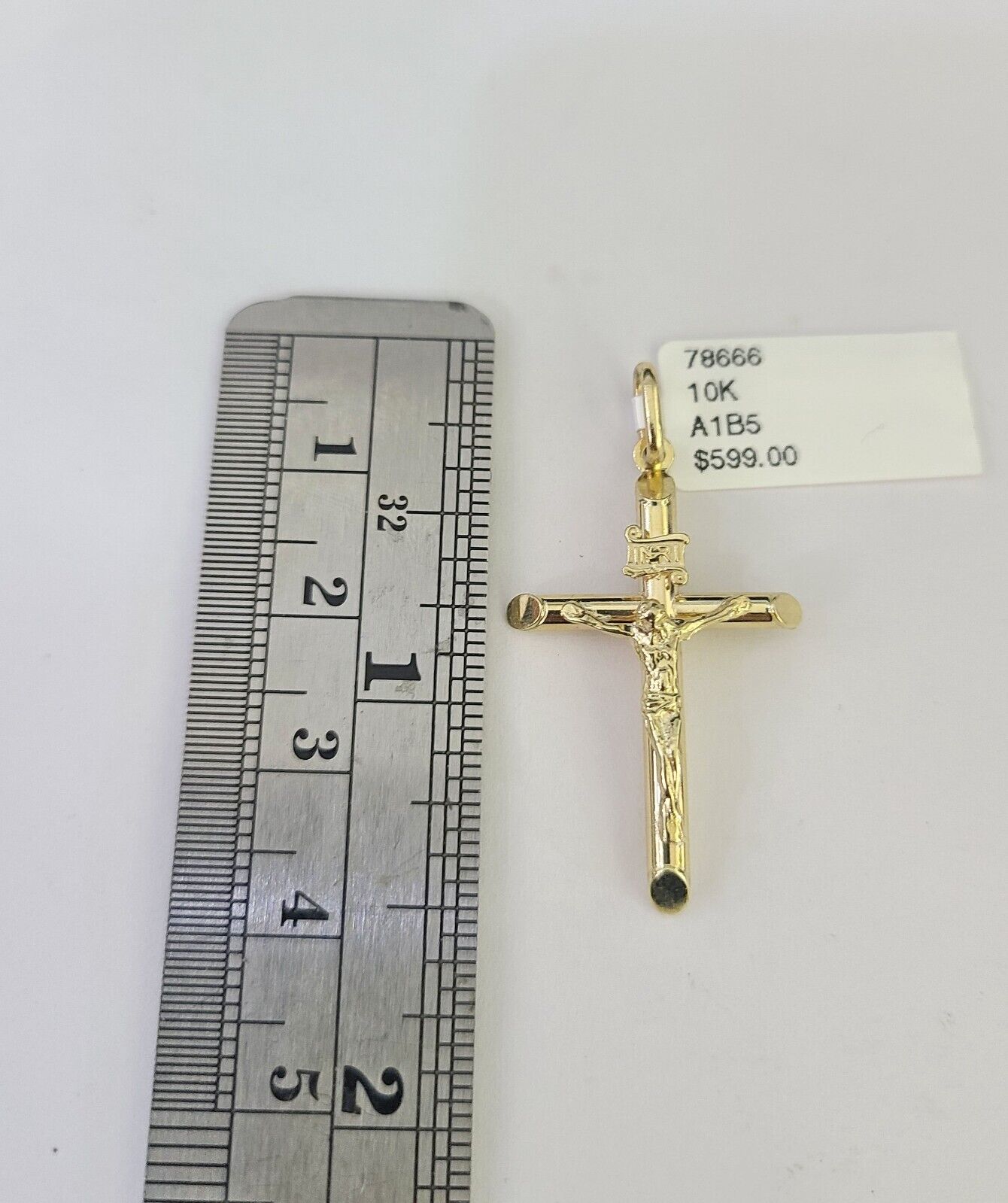 Side angle view of Franco chain necklace featuring INRI Jesus cross pendant charm