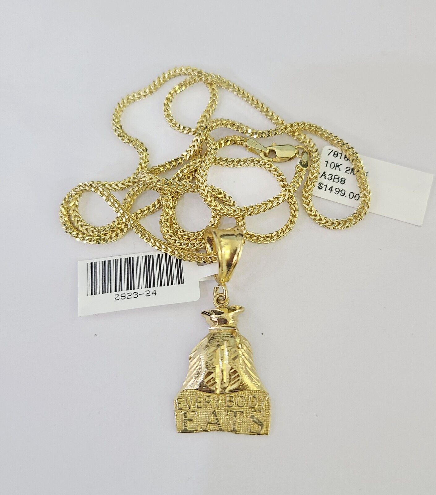 Front view of “Everybody Eats” pendant necklace in 10K gold with Franco chain